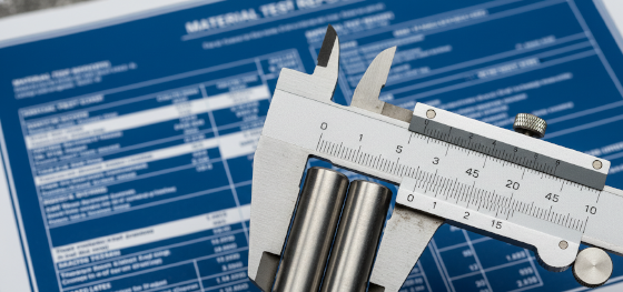 Vernier calipers measuring 1018 and 1045 cold-drawn steel bars with a material test report blueprint_ Vernier calipers measuring 1018 and 1045 cold-drawn steel bars with a material test report blueprint_